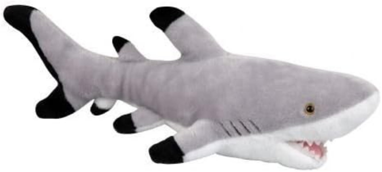 Plush shark toy with gray body, white underbelly, and black fins on a white background