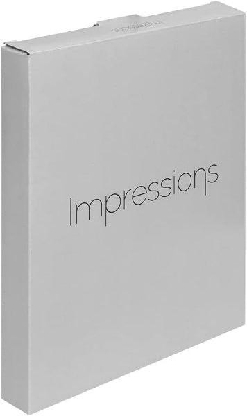 Silver photo album with 'Impressions' branding on a white background