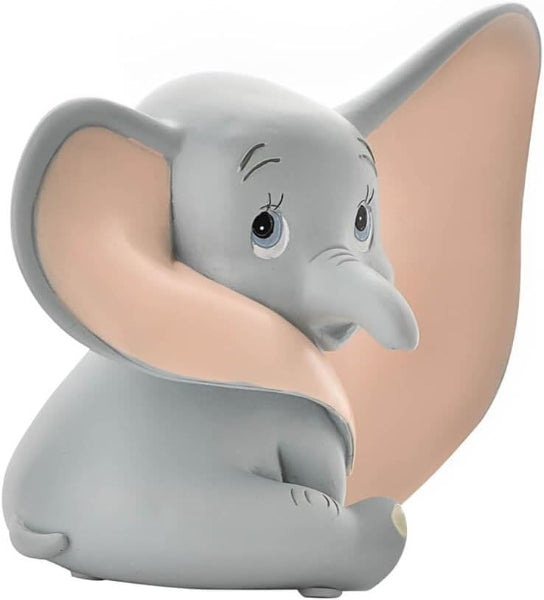 Gray elephant figurine with large ears on a white background