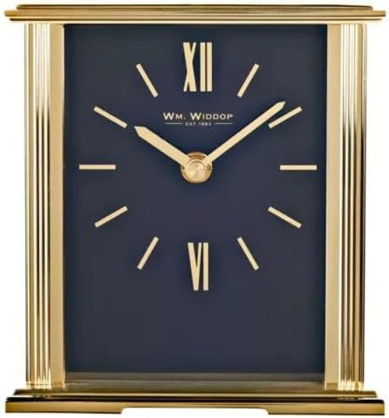 Table clock with gold frame and navy face, featuring the brand 'W.M. Widdop'.