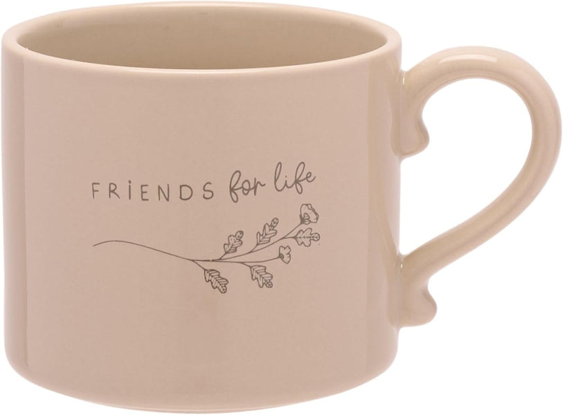 Beige mug with 'Friends for life' text and floral design on a white background