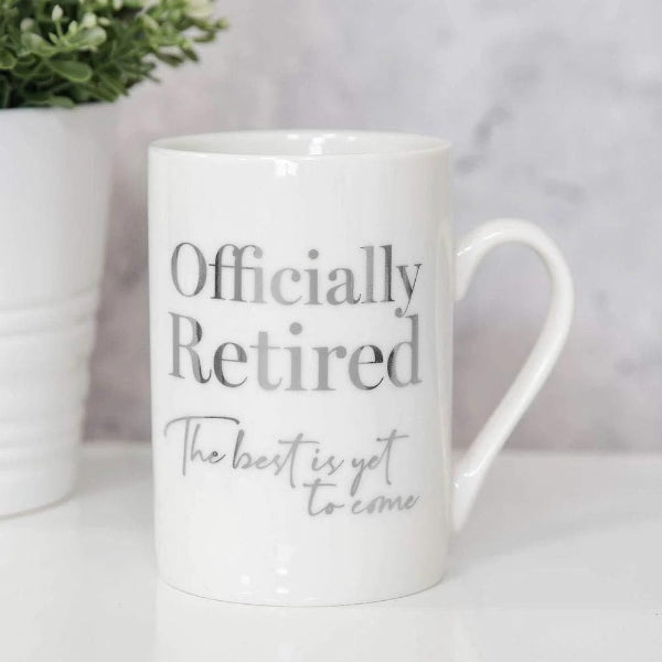 White mug with 'Officially Retired' text on a light background