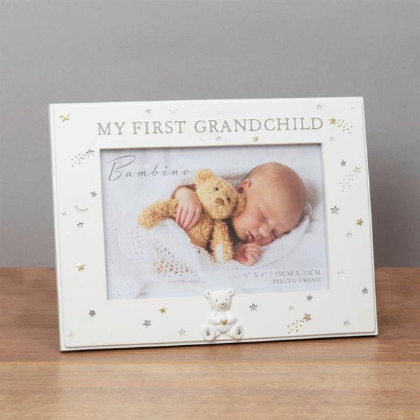 White photo frame with 'My First Grandchild' text and a baby holding a teddy bear inside.