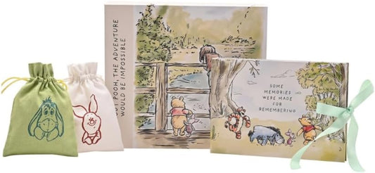 Set of Winnie the Pooh-themed items including bags and a card with illustrations and text.