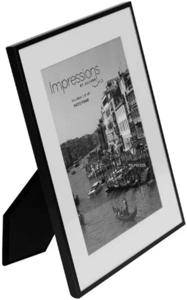 Black photo frame with a scenic picture of a city by a river