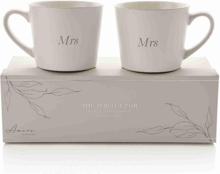 Two white mugs labeled 'Mrs.' on a matching box with 'Amore' branding.