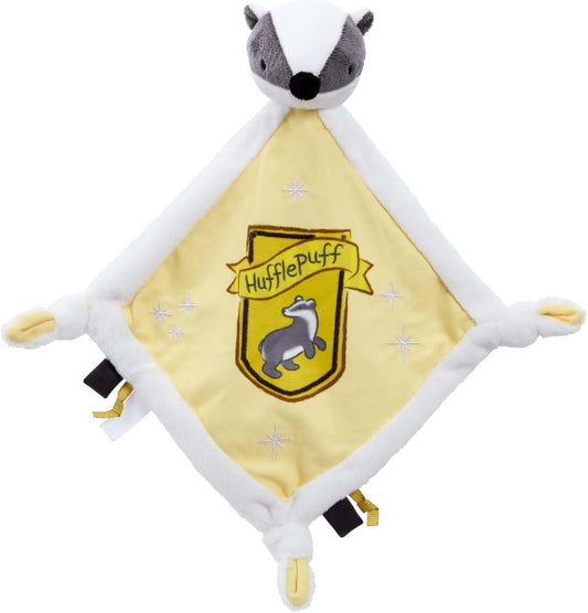 Plush toy with Hufflepuff badge on a white background
