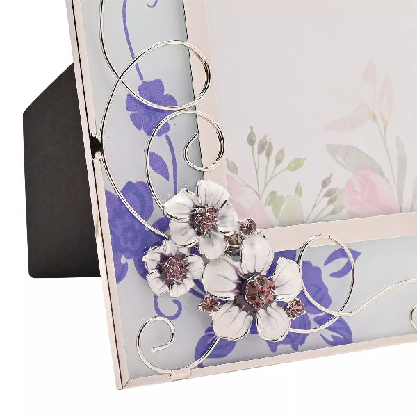 Decorative photo frame with floral design and intricate metalwork