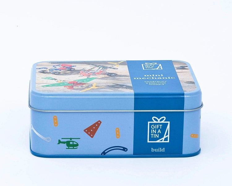Blue tin box with toy illustrations and text on a white background