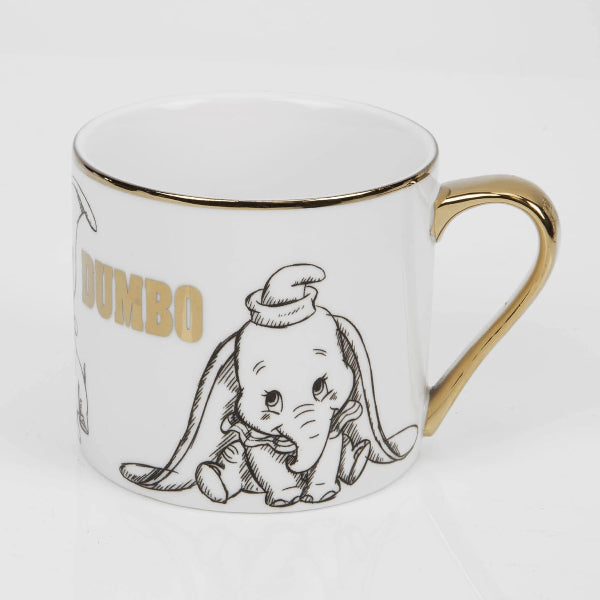 Mug with Dumbo illustration and gold accents on a white background
