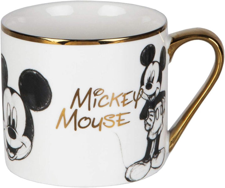 Mug with Mickey Mouse design and gold accents on a white background