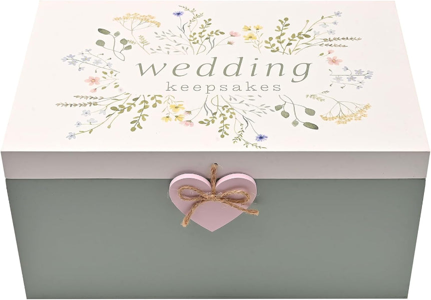 Wedding keepsakes box with floral design and heart-shaped bow on a light pink background