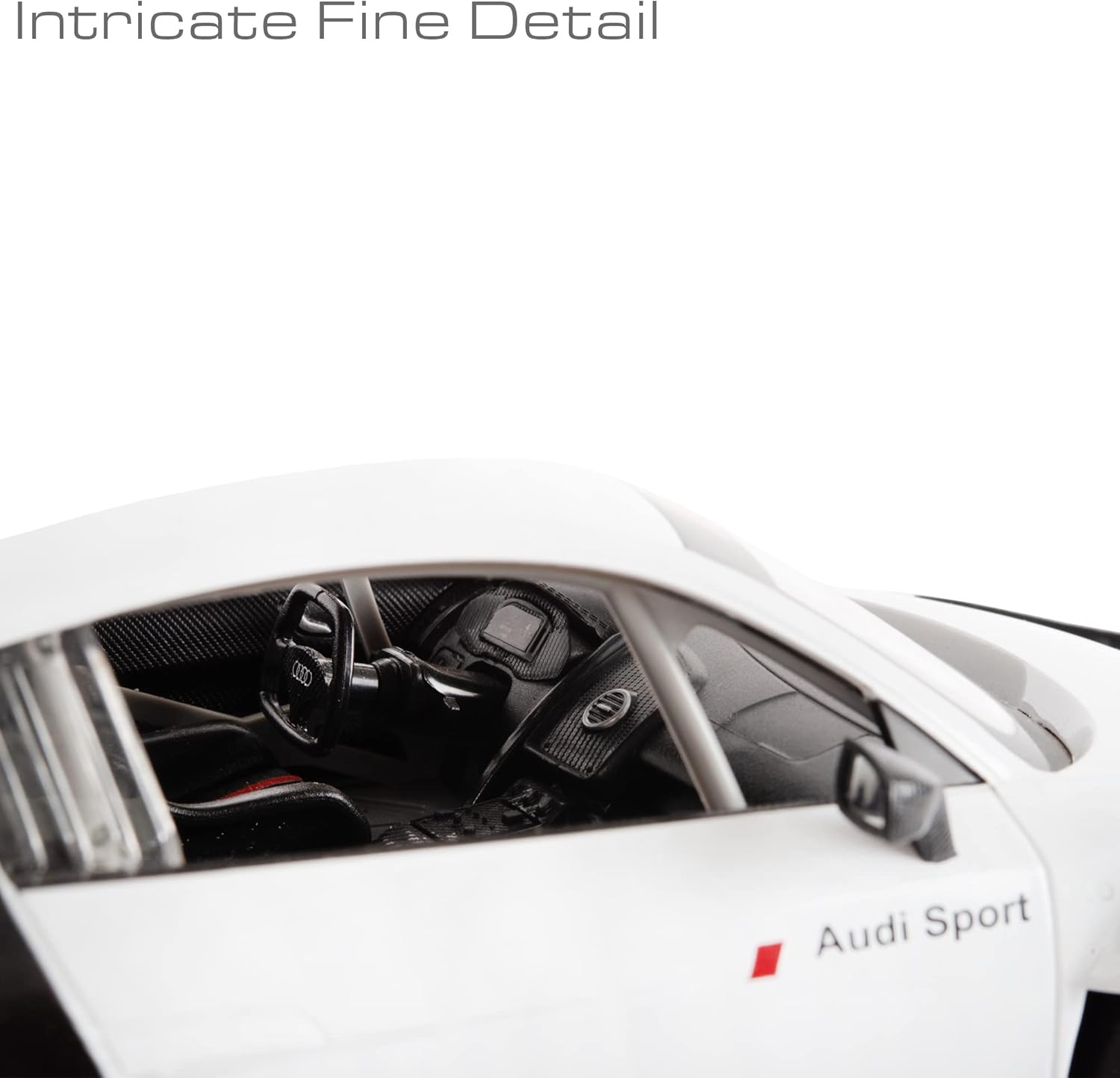 Close-up of an Audi car interior with 'Audi Sport' branding on a white background.