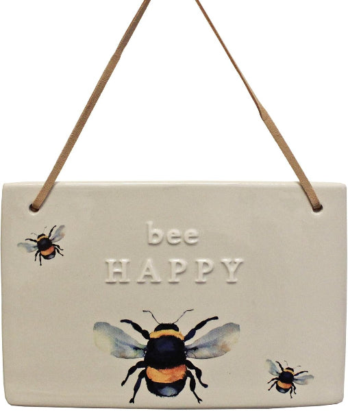 Decorative sign with 'bee happy' text and bee illustrations on a beige background
