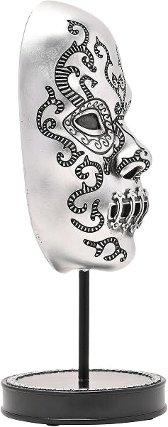 Decorative skull with intricate designs on a stand