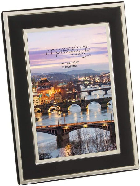 Black and silver photo frame with a scenic cityscape print on a white background