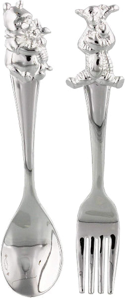 Silver spoon and fork with decorative handles on a white background