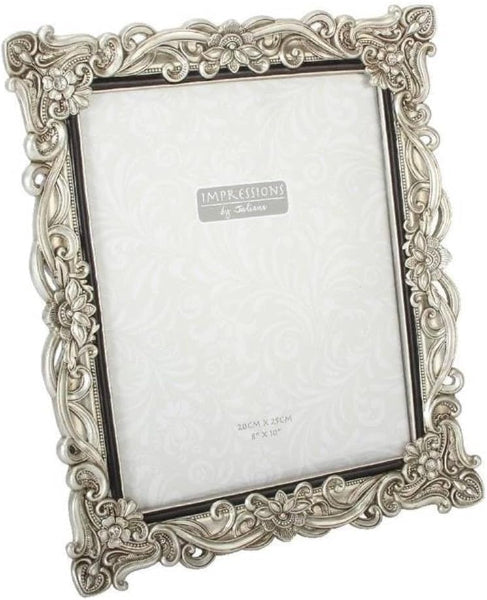 Decorative silver photo frame with 'Impressions' branding on a white background