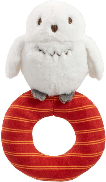 Plush toy owl on a red striped ring with a white background