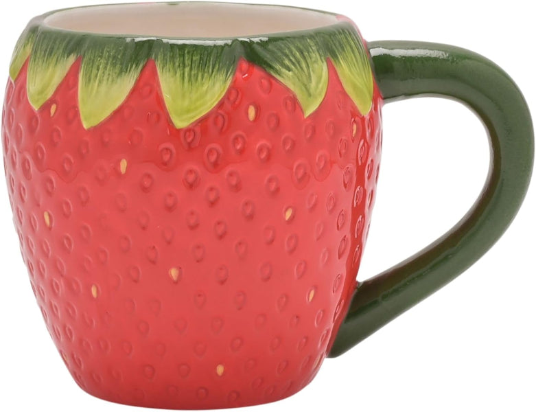 Strawberry-shaped mug with green leaves on a white background