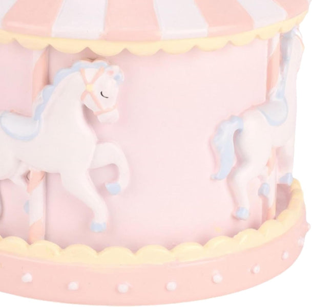 Pink carousel toy with unicorn figures on a white background