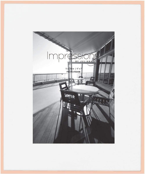 Black and white photo of a patio with furniture, framed with a pink border and 'Impressions by Juliana' text.