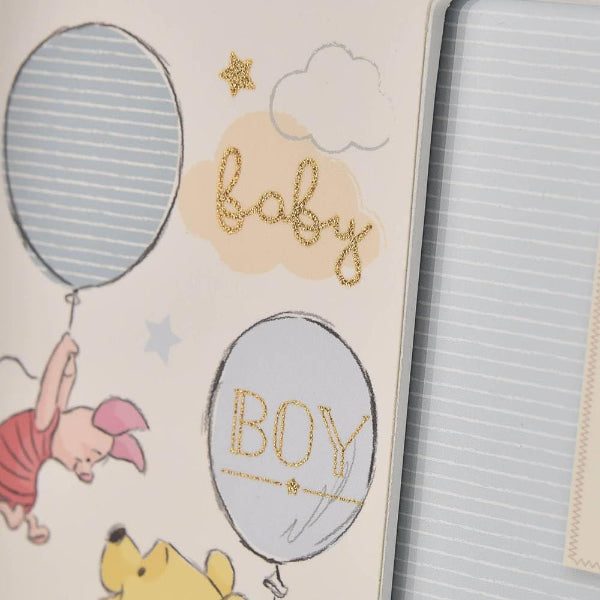 Baby shower card with balloons and text 'baby boy' featuring cartoon characters.