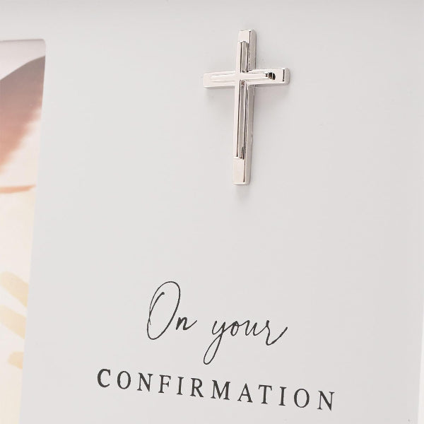 Silver cross on a white card with 'On your Confirmation' text