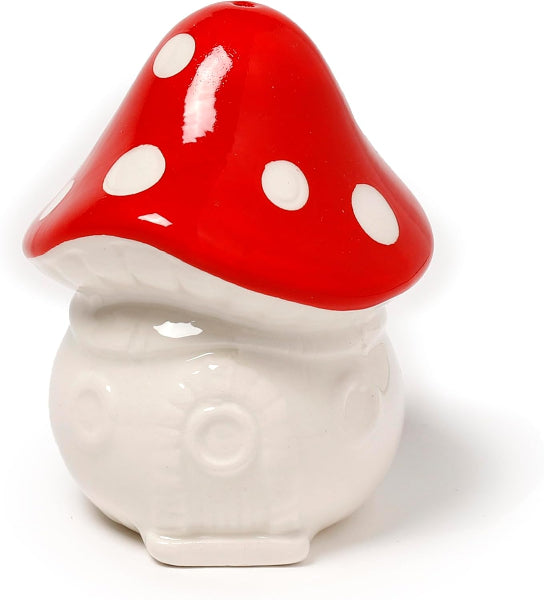 Ceramic mushroom-shaped container with a red cap and white spots on a white background