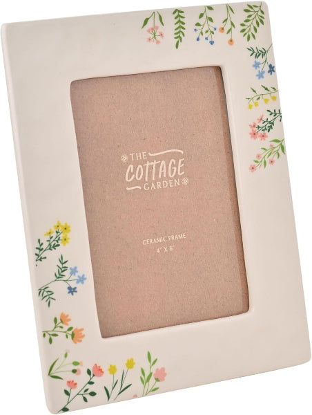 Ceramic photo frame with floral designs on a white background