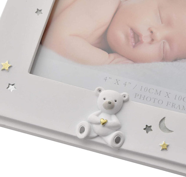Gray photo frame with a teddy bear ornament and a baby photo inside