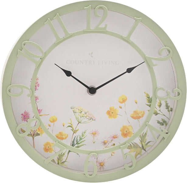 Decorative wall clock with floral design and 'Country Living' branding on a white background