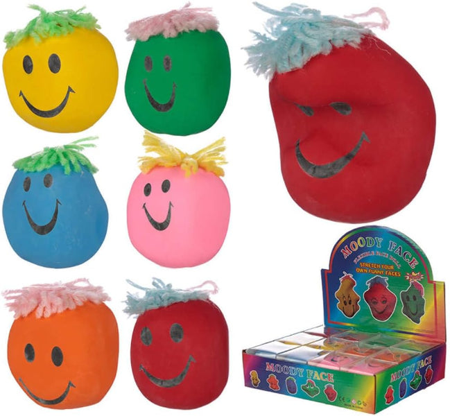 Set of colorful plush toys with smiling faces, including a box of the product.