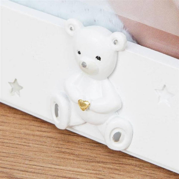 White phone case with a bear design on a wooden surface