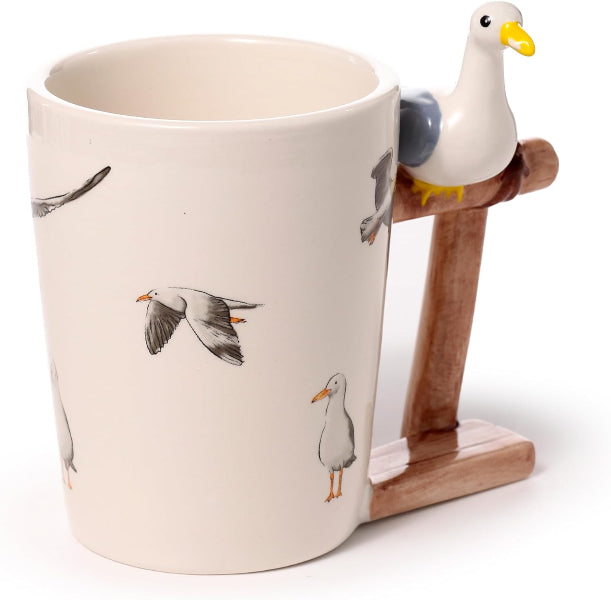 Mug with seagull design and wooden stand on a white background