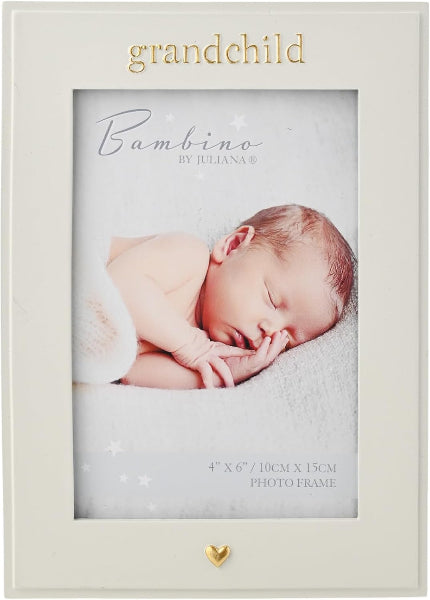 A personalized cream-colored picture frame with gold foil text reading 'grandchild' at the top and a small gold heart at the bottom. The frame is shown containing a sample photo of a sleeping newborn baby with the text 'Bambino BY JULIANA' and size details.