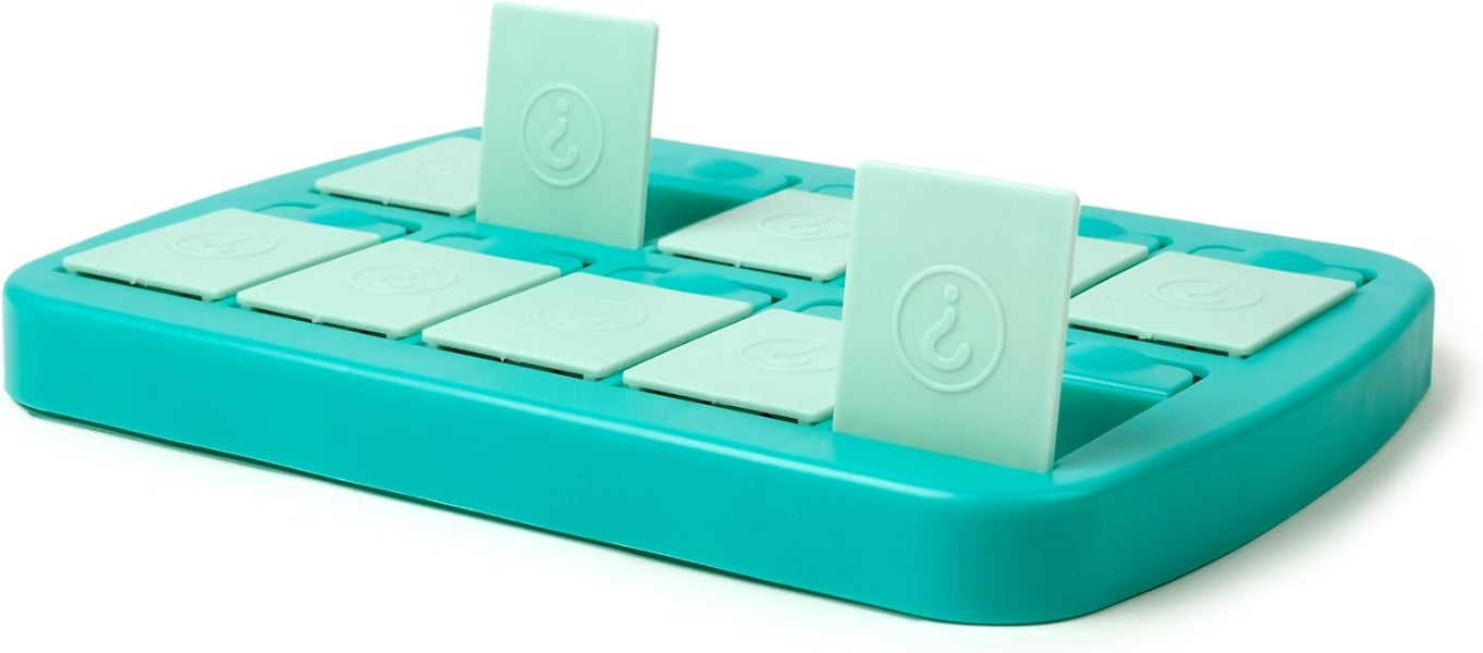 Turquoise ice cube tray with clear silicone molds on a white background