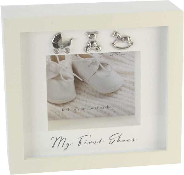 Decorative box with baby shoes and toys on a textured surface, featuring 'My First Shoes' text.