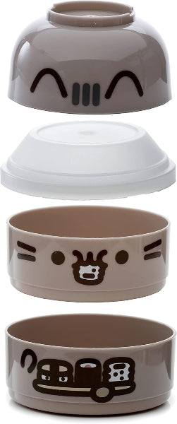 Set of four ceramic bowls with cartoon face designs on a white background