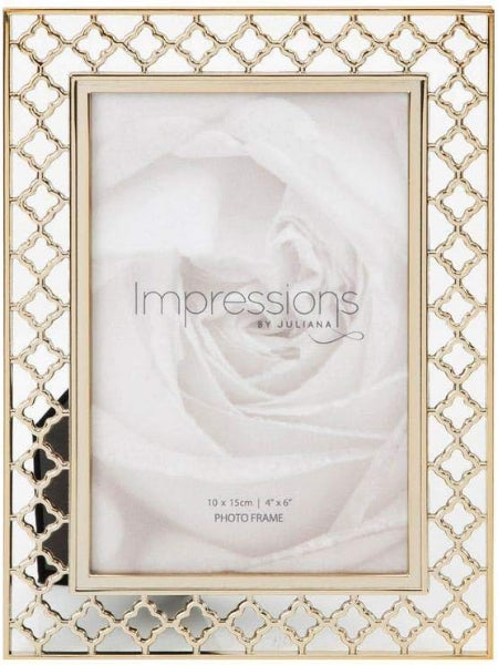 A square photo frame with a gold-toned trellis pattern border and a slim inner gold frame, shown holding a pale rose photo print. The frame is photographed straight-on against a white background.