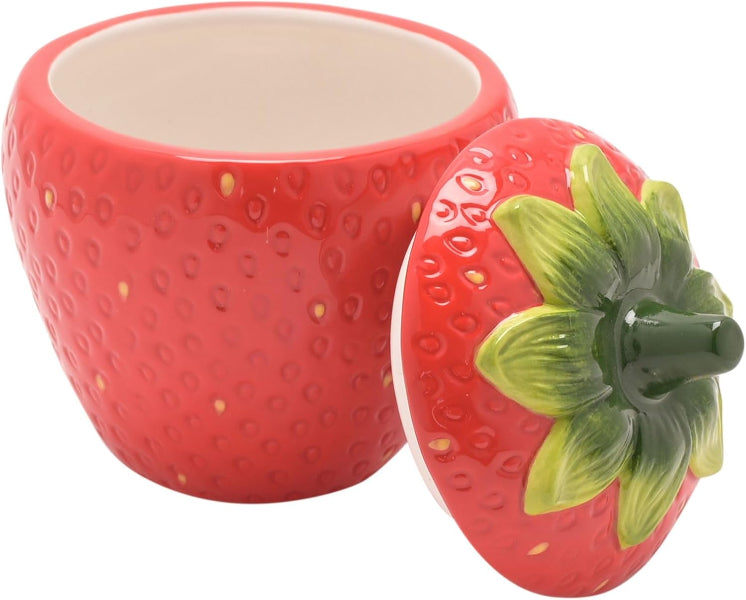 Ceramic strawberry-shaped container with a lid on a white background
