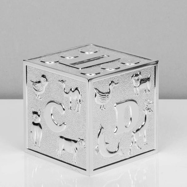 Decorative silver cube with embossed animal designs on a white background