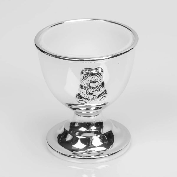 Clear glass with a silver emblem on a white background