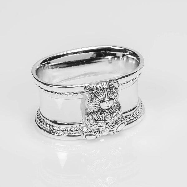 Silver napkin ring with a lion design on a white background