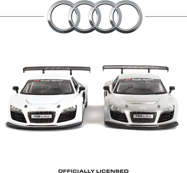 Two Audi cars with a large Audi logo above them on a white background.
