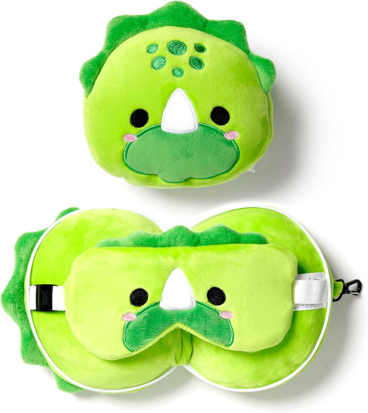 Green dinosaur-shaped eye mask and pillow set on a white background