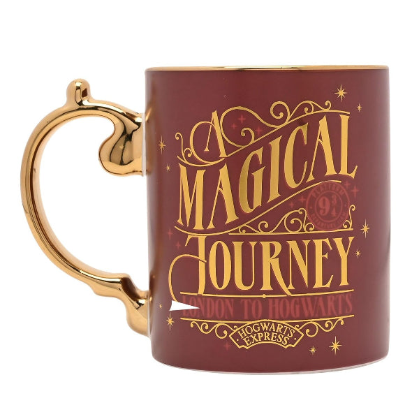 Maroon mug with gold handle and 'A Magical Journey' text on a white background