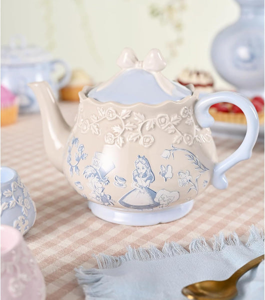 Decorative teapot with floral patterns on a tablecloth