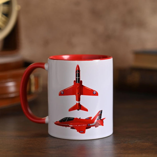 Mug with red airplane design on a wooden surface