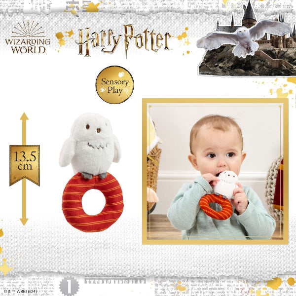 Harry Potter sensory play toy with a baby holding it, featuring the Hogwarts castle and Hedwig the owl.